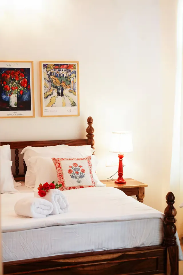 Aurora Luxe Residence — cozy bedroom with handcrafted lamp and art