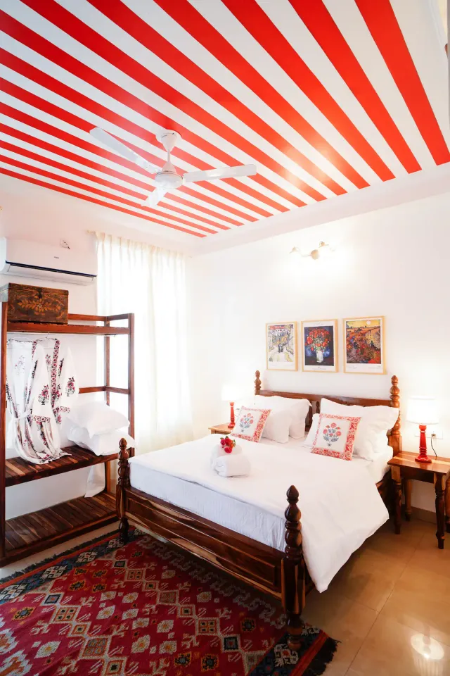 Aurora Luxe Residence — bright bedroom with printed drapes