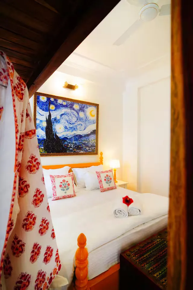 Met Luxe Galleria — bedroom with iconic artwork and printed cushions