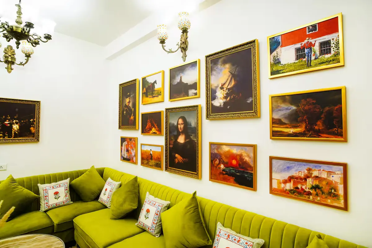 Met Luxe Galleria — chandelier-lit lounge with gallery wall of masterpieces, Jaipur