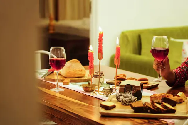 Met Luxe Galleria — candlelit evening spread with wine glasses
